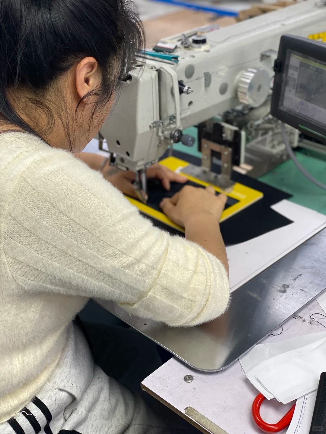 Precision stitching detail in bag production